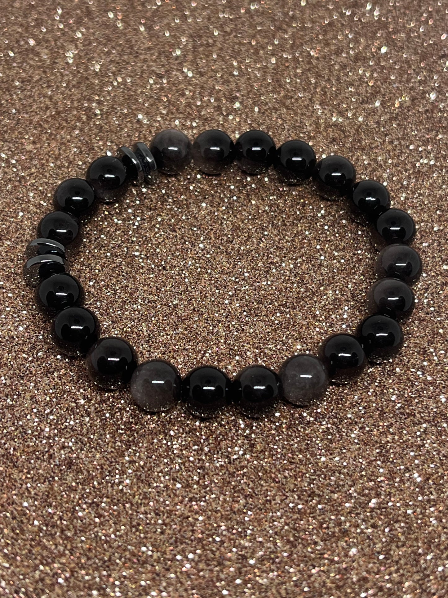 Sort sølvobsidian med sort hematitt