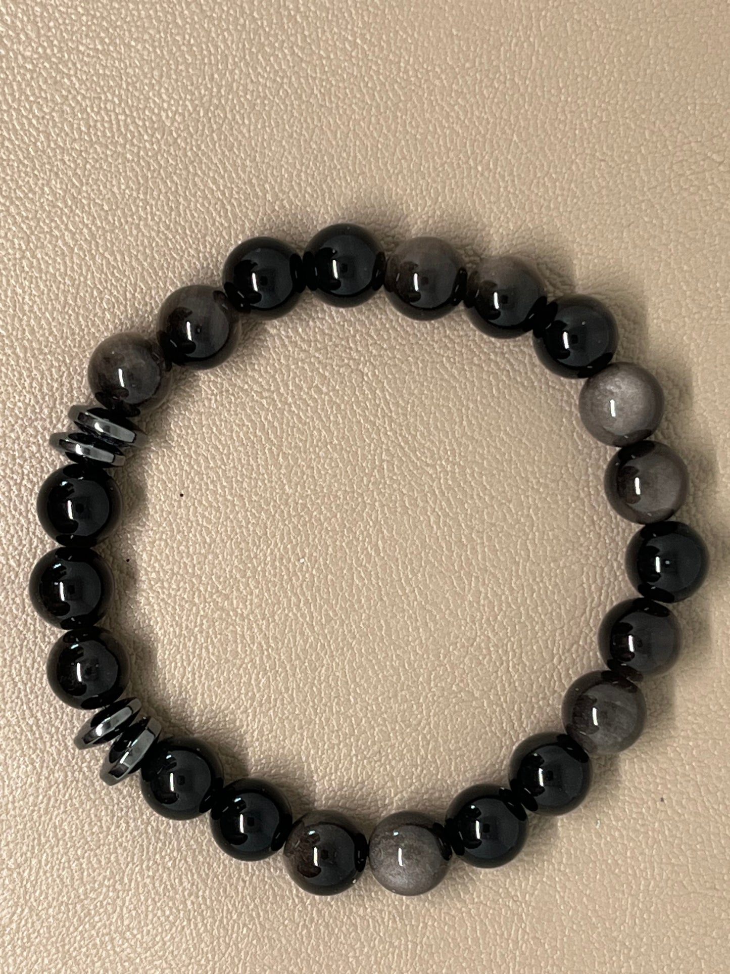 Sort sølvobsidian med sort hematitt