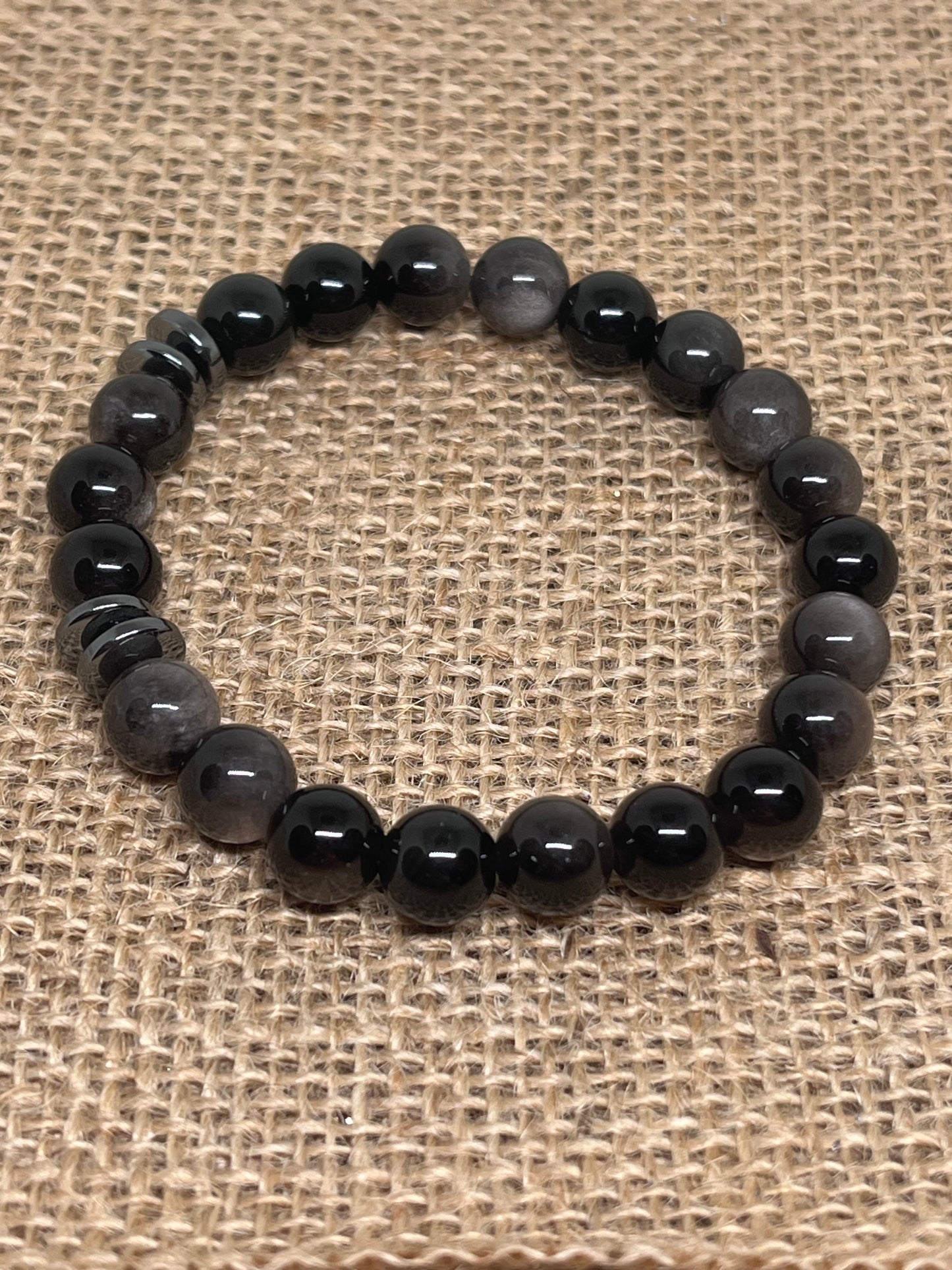 Sort sølvobsidian med sort hematitt