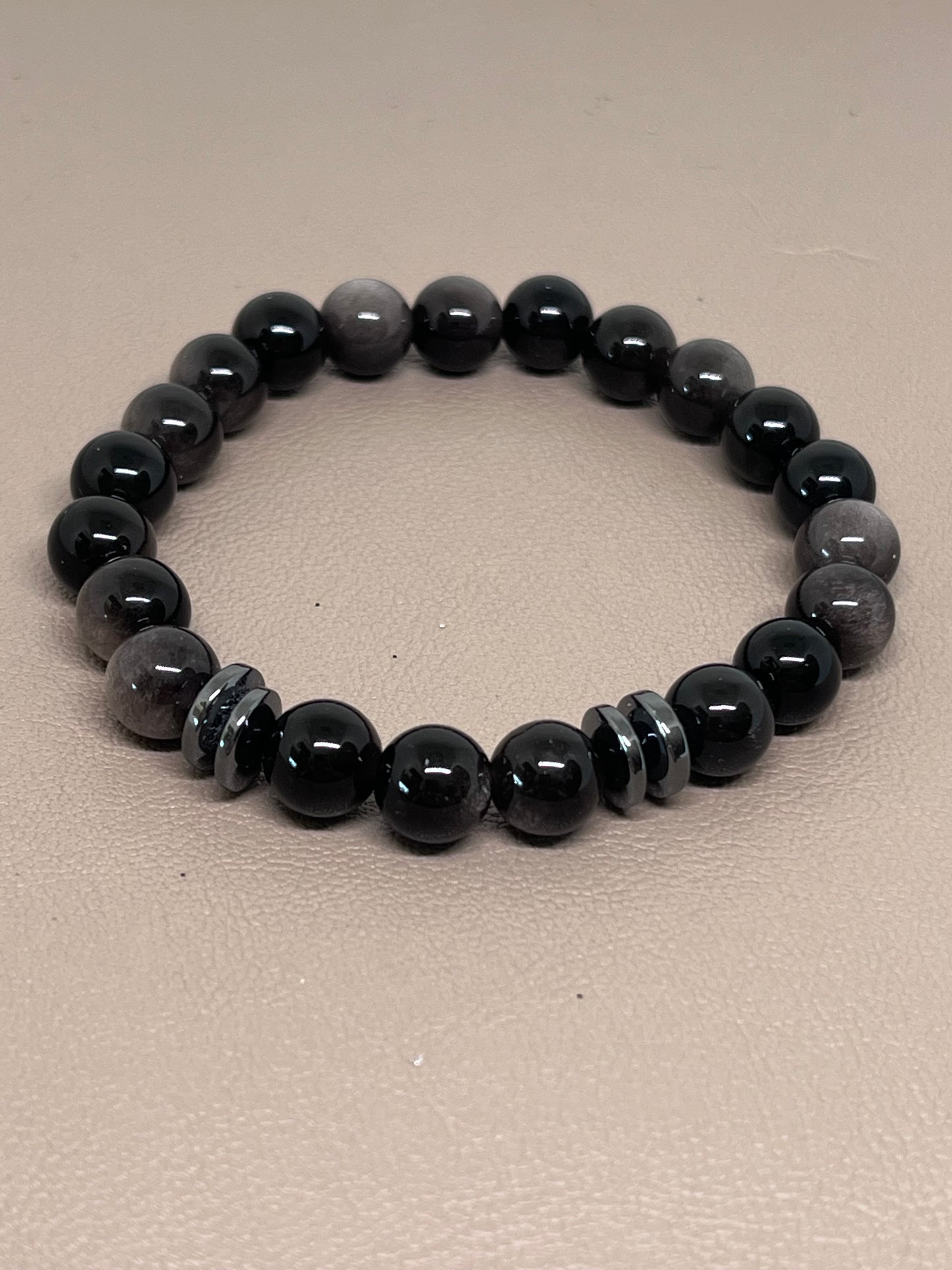 Sort sølvobsidian med sort hematitt