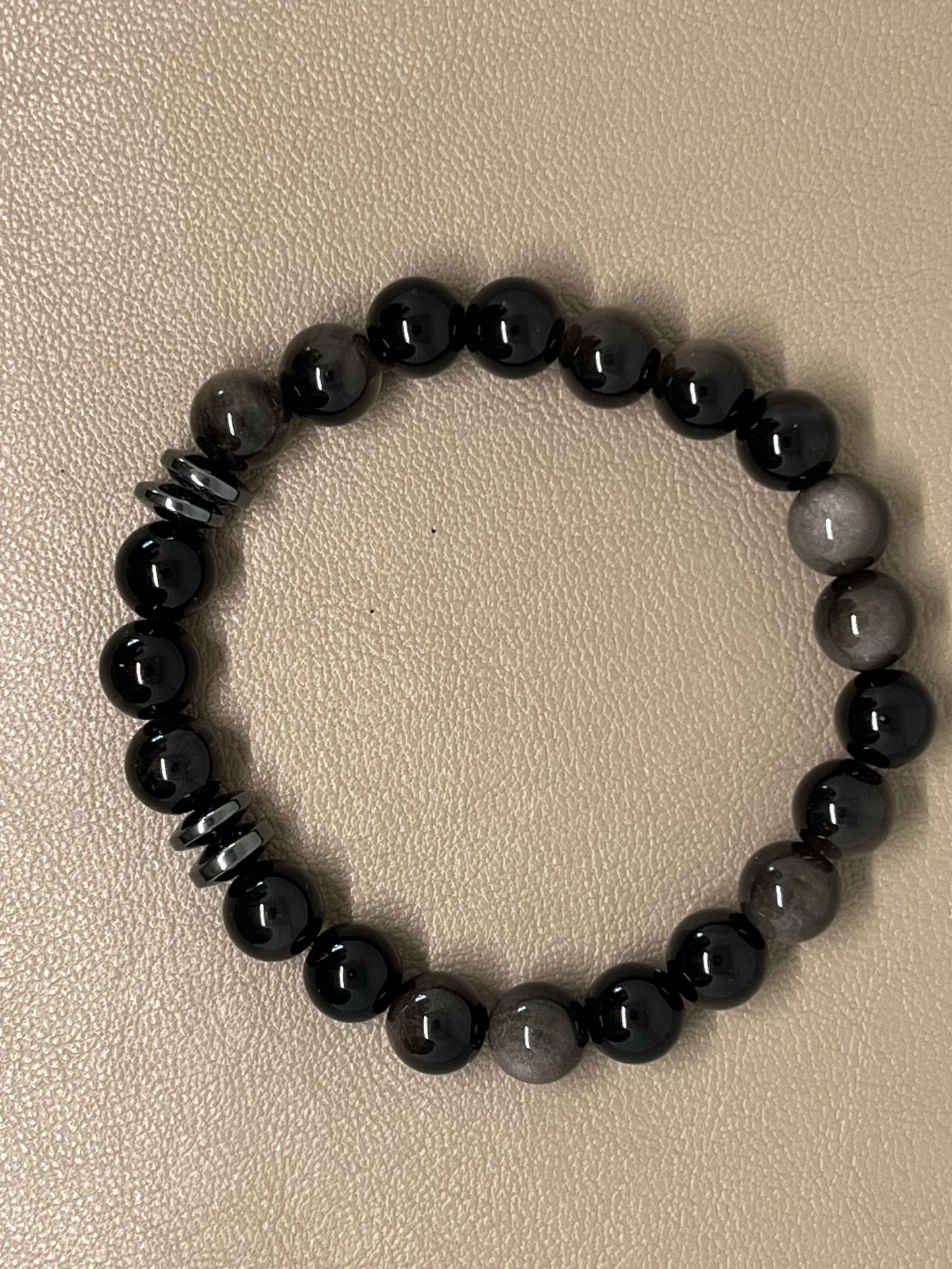 Sort sølvobsidian med sort hematitt