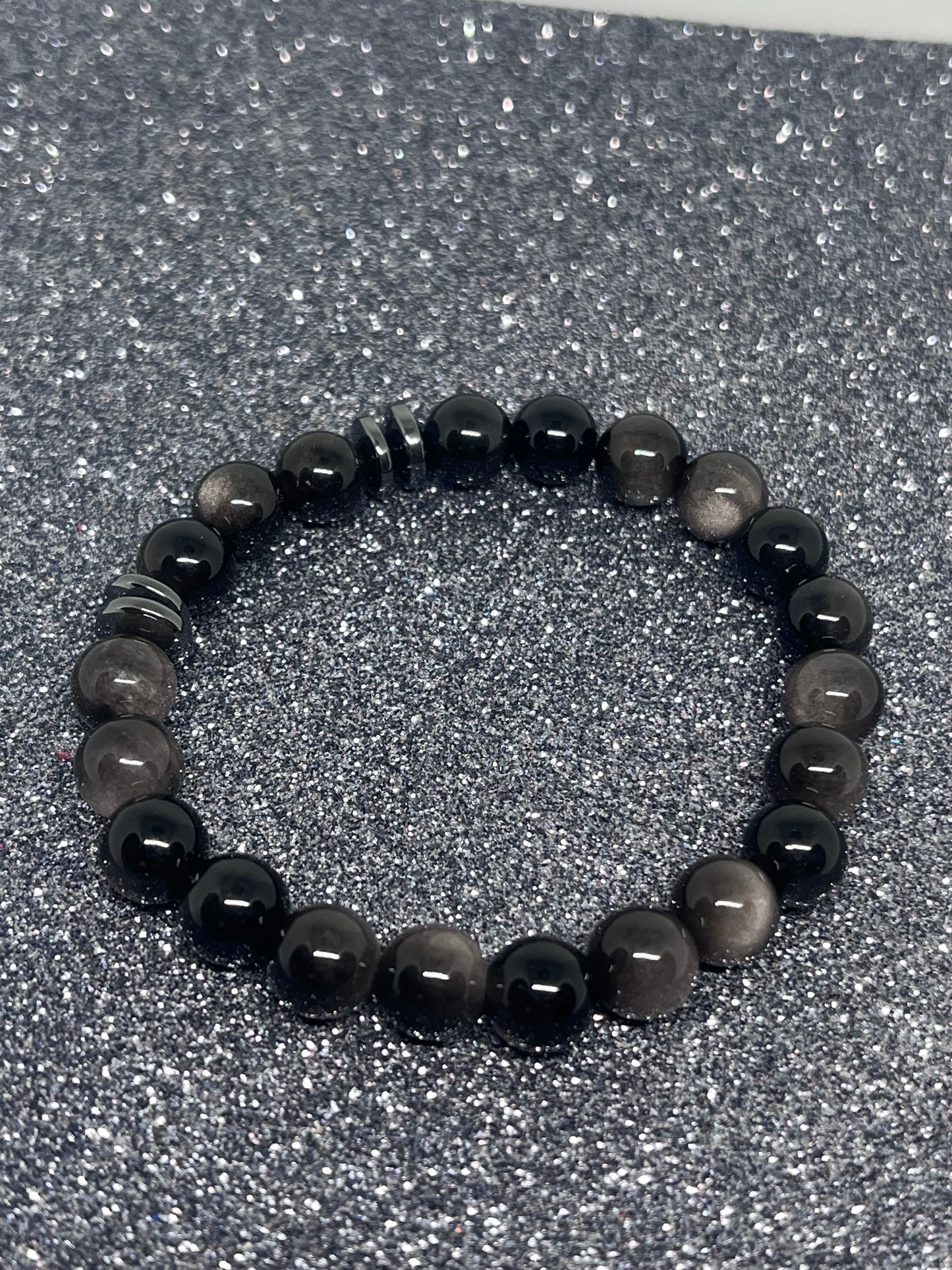 Sort sølvobsidian med sort hematitt