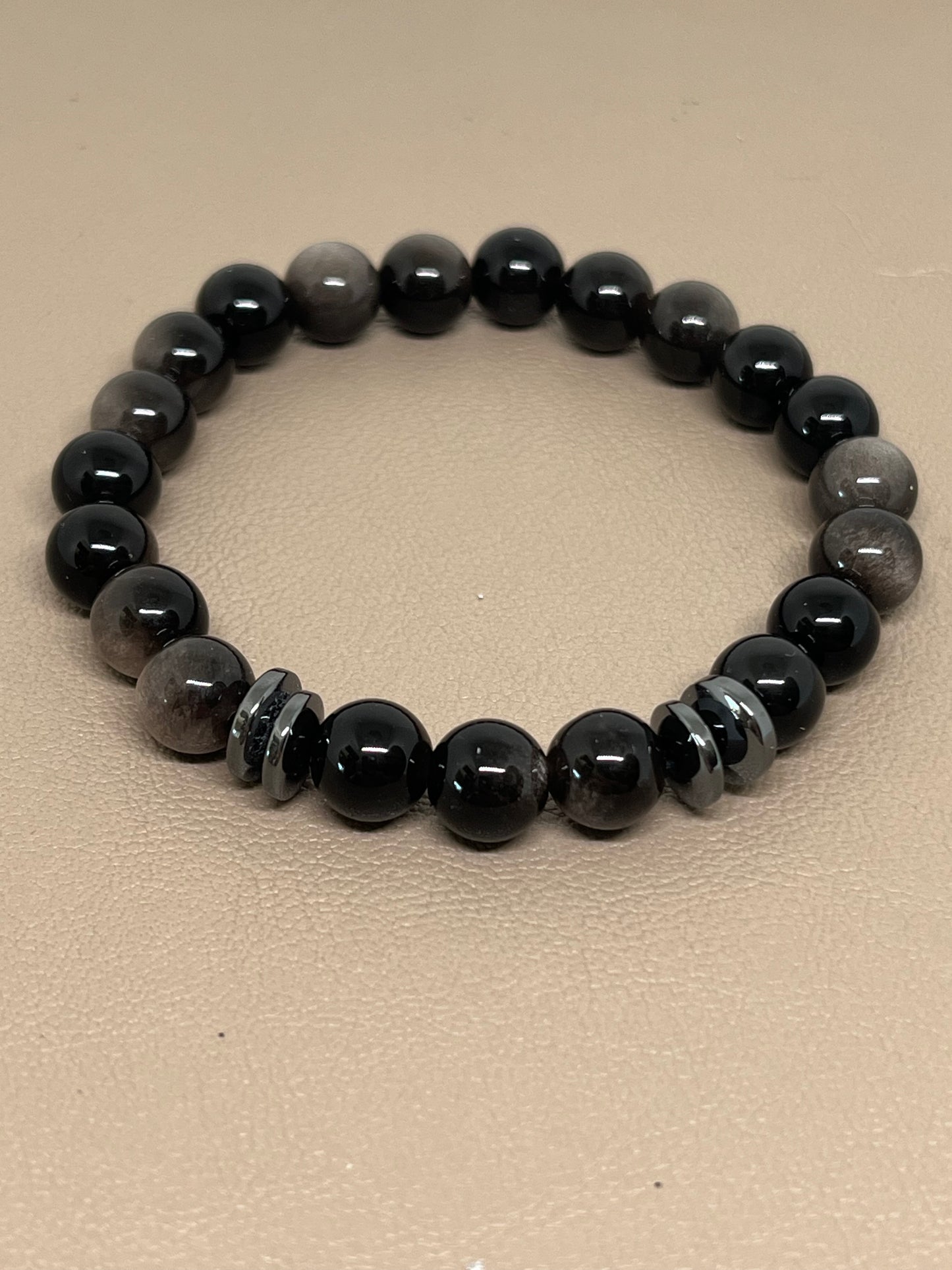 Sort sølvobsidian med sort hematitt